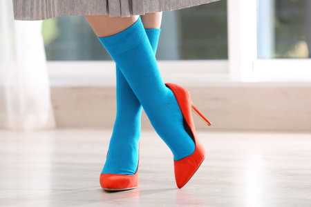 Woman in stylish socks and shoes indoors, closeupの写真素材