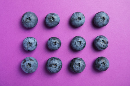 Flat lay composition with tasty blueberry on color backgroundの写真素材