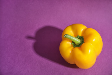Raw ripe paprika pepper on color backgroundの写真素材