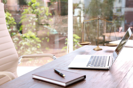 Lawyer's workplace with laptop in officeの写真素材