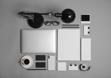 Flat lay composition with stationery on gray background. Mock up designの写真素材