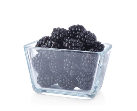 Glass bowl with blackberries on white backgroundの写真素材