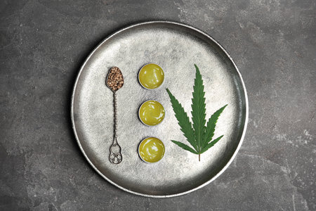 Flat lay composition with hemp lotion on gray backgroundの写真素材