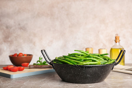 Dish with tasty green beans on tableの写真素材