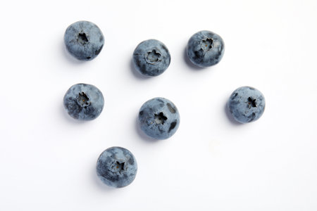 Flat lay composition with tasty blueberry on white backgroundの写真素材