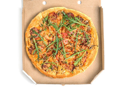 Cardboard box with tasty pizza on white background, top viewの写真素材
