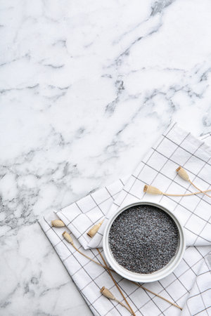 Flat lay composition with poppy seeds on marble backgroundの写真素材
