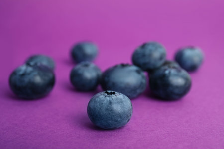 Tasty ripe blueberry on color background, closeupの写真素材