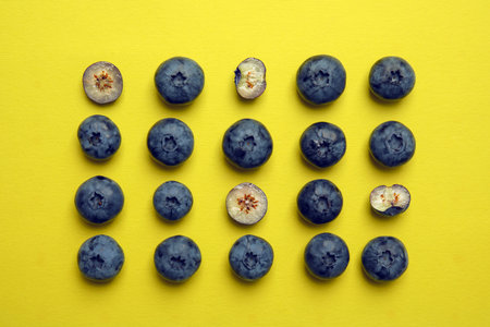Flat lay composition with tasty blueberry on color backgroundの写真素材