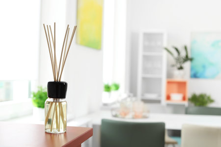 Aromatic reed air freshener on table in roomの写真素材