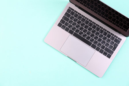 Modern laptop on color background, top viewの写真素材