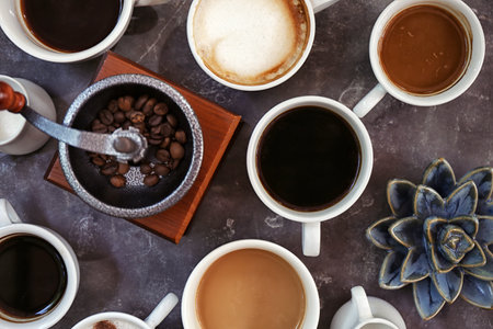 Cups of fresh aromatic coffee on gray background, top viewの写真素材