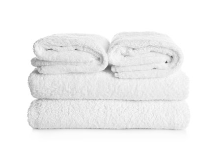 Stack of clean soft towels on white backgroundの写真素材