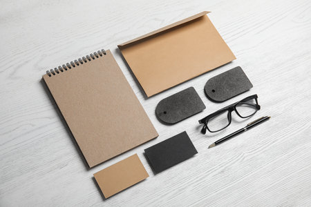 Composition with stationery on white wooden background. Mock up designの写真素材