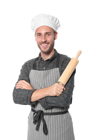 Professional chef holding rolling pin on white backgroundの写真素材