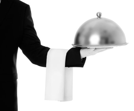 Waiter holding metal tray with lid on white background, closeupの写真素材