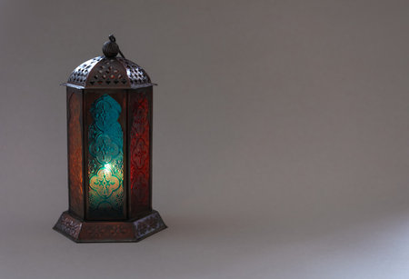 Muslim lamp with candle on gray background. Fanous as Ramadan symbolの写真素材