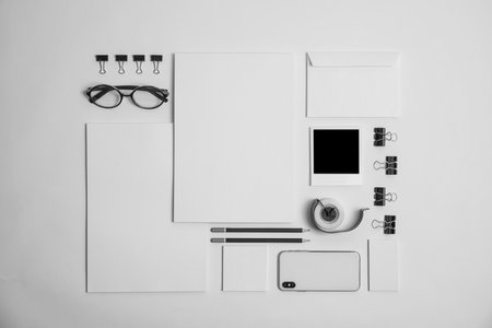 Flat lay composition with stationery on light background. Mock up designの写真素材