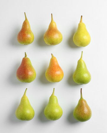 Fresh pears on light background, flat lay compositionの写真素材