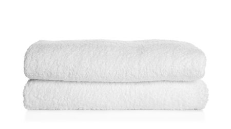 Stack of clean soft towels on white backgroundの写真素材