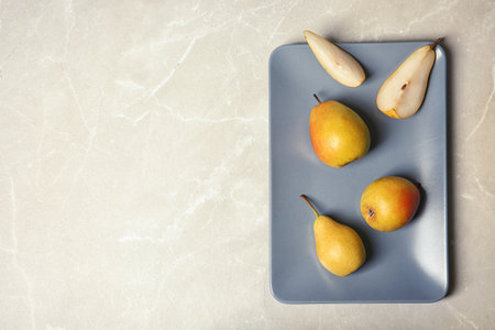 Flat lay composition with ripe pears on gray background. Space for textの写真素材