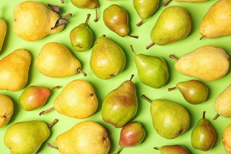 Flat lay composition with fresh ripe pears on color backgroundの写真素材
