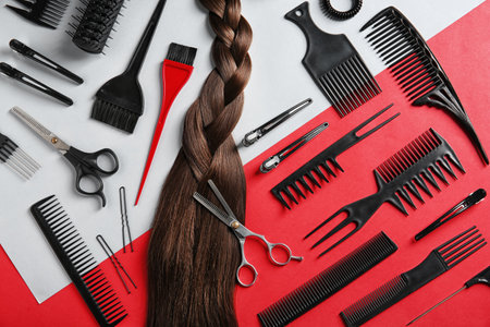 Flat lay composition with hair salon tools on color backgroundの写真素材
