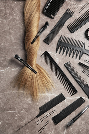 Flat lay composition with hair salon tools on gray backgroundの写真素材