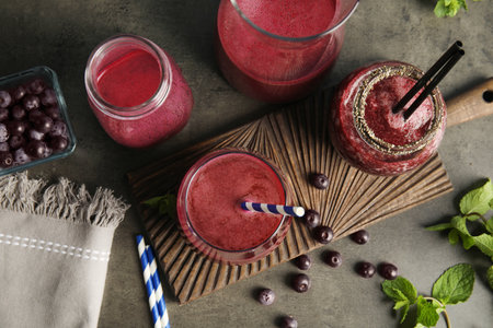 Flat lay composition with delicious acai juice on dark tableの写真素材