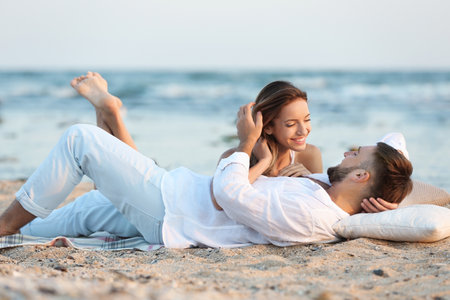 Young couple spending time together on the beachの写真素材