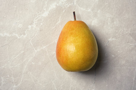 Ripe pear on gray background, top viewの写真素材