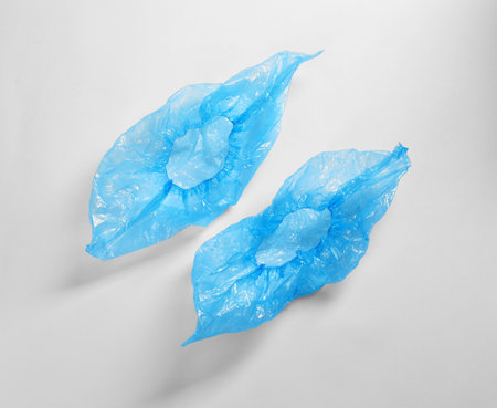 Medical blue shoe covers on white backgroundの写真素材