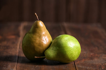Tasty ripe pears on rustic wooden backgroundの写真素材
