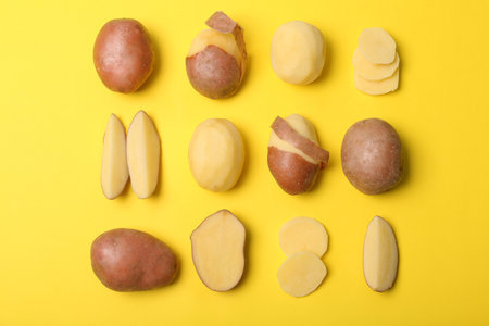 Flat lay composition with fresh organic potatoes on color backgroundの写真素材