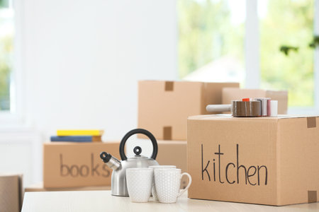 Moving boxes and household stuff indoors. Space for textの写真素材