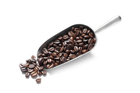 Scoop with roasted coffee beans on white backgroundの写真素材