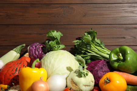 Many fresh ripe vegetables on wooden background, top view. organic foodの写真素材
