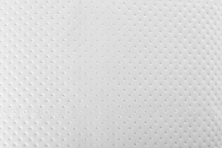 Perforated toilet paper as background, closeup. personal hygiene