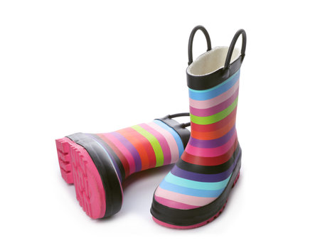 Colorful children's rubber boots on white backgroundの写真素材