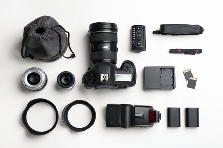 Flat lay composition with photographer's equipment and accessories on white backgroundの写真素材