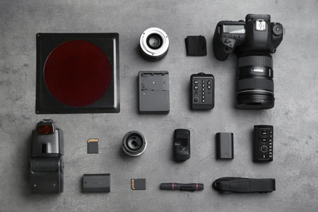 Flat lay composition with photographer's equipment and accessories on gray backgroundの写真素材