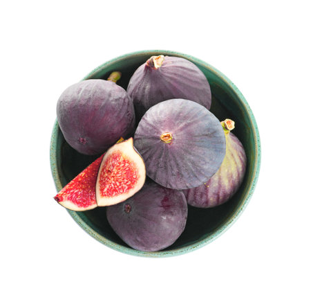 Bowl with whole and cut purple figs on white background, top viewの写真素材