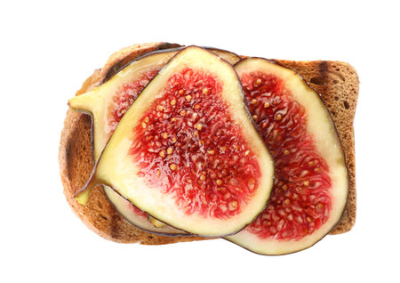 Toasted bread with ripe fig slices on white background, top viewの写真素材