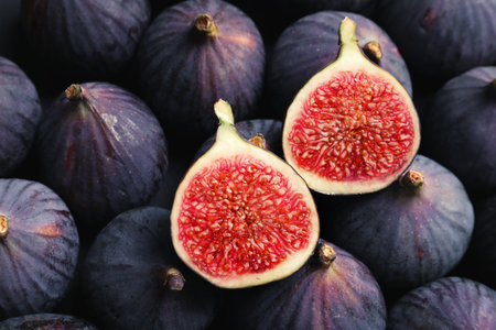 Fresh ripe figs as background, top view. tropical fruitsの写真素材