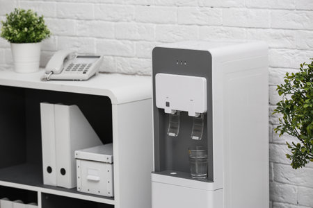 Modern water cooler in stylish office interiorの写真素材