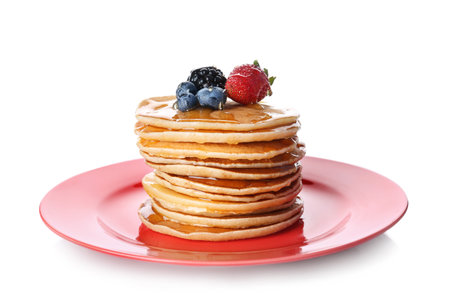 Plate with stack of tasty pancakes and fresh berries on white backgroundの写真素材