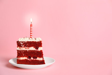 Plate with piece of delicious homemade red velvet cake and space for text on color backgroundの写真素材