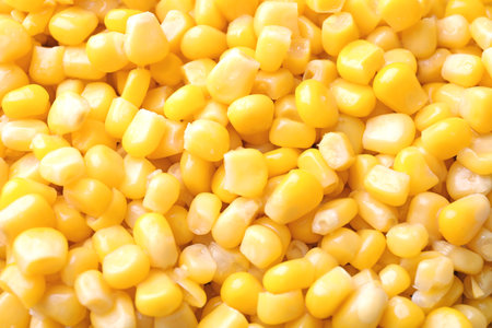Ripe corn kernels as background, top view