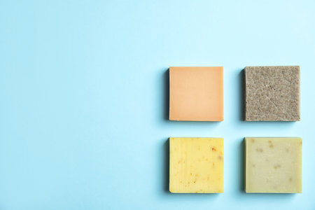 Hand made soap bars on color background, top view. Space for textの写真素材