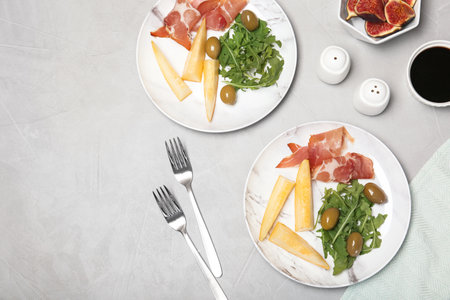 Flat lay composition with melon appetizer served on table. Space for textの写真素材